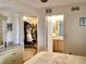 Main bedroom with tile flooring, walk-in closet, and ensuite bathroom at 4529 Whitton Way # 214, New Port Richey, FL 34653