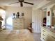 Comfortable main bedroom features neutral decor and tile flooring at 4529 Whitton Way # 214, New Port Richey, FL 34653
