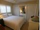 Bedroom with a ceiling fan and mirrored closet at 4801 Airport Rd # 208, Zephyrhills, FL 33542