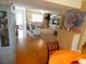 Bright living room featuring comfortable seating, entertainment center, and neutral décor at 4801 Airport Rd # 208, Zephyrhills, FL 33542