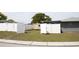 Fenced backyard with shed offering privacy and extra storage space at 6030 Redwood Dr, New Port Richey, FL 34653