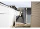 Exterior view of the side of the home, highlighted by a white privacy fence at 6030 Redwood Dr, New Port Richey, FL 34653