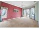 Large bedroom with neutral carpet, decorative windows, and ample space for furniture and relaxation at 6112 Kinlock Ave, Spring Hill, FL 34608