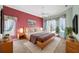 Primary bedroom featuring a king-size bed, ceiling fan and bay windows at 6112 Kinlock Ave, Spring Hill, FL 34608