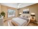 Nicely staged bedroom with a large window, neutral walls, and a minimalist design for a peaceful space at 6112 Kinlock Ave, Spring Hill, FL 34608