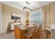 Dining space featuring a kitchen island with bar seating, modern lighting, and window at 6112 Kinlock Ave, Spring Hill, FL 34608