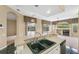View of the kitchen sink, bar counter and the open floor plan into the living and dining room at 6112 Kinlock Ave, Spring Hill, FL 34608
