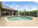 This pool is surrounded by a screened enclosure and offers ample room for entertaining at 6112 Kinlock Ave, Spring Hill, FL 34608