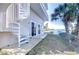 Backyard featuring a spiral staircase, patio, and waterfront views at 6801 Nowiki Ave, Hudson, FL 34667
