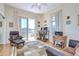 Comfortable bedroom with a balcony, workstation, and natural light at 6801 Nowiki Ave, Hudson, FL 34667