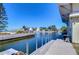 Picturesque waterfront canal view with a private dock, perfect for boating enthusiasts at 6801 Nowiki Ave, Hudson, FL 34667