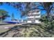 Three-story house with ample garage space, balconies, and waterfront boat access at 6801 Nowiki Ave, Hudson, FL 34667