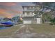 Stunning waterfront home with balconies, boat lift, and convenient garage access at 6801 Nowiki Ave, Hudson, FL 34667