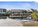 The dock features a boat lift for easy storage and launching, enhancing the waterfront lifestyle at 8225 Channel Dr, Port Richey, FL 34668