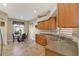 Bright kitchen features wood cabinets, tile backsplash, and a cozy breakfast nook at 10910 May Apple Ct, Land O Lakes, FL 34638