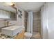 Modern bathroom features a stylish vanity, updated shower, and tiled walls at 1101 N Betty Ln, Clearwater, FL 33755