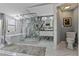 Bathroom featuring new glass enclosed shower, free standing tub and stylish marble flooring and tile at 1101 N Betty Ln, Clearwater, FL 33755