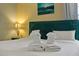 Cozy bedroom featuring a decorative headboard and matching lamps for a relaxing and inviting retreat at 1101 N Betty Ln, Clearwater, FL 33755