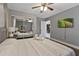 Bedroom with ceiling fan, wood floors, and mirrored closet at 1101 N Betty Ln, Clearwater, FL 33755