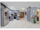 Bright kitchen featuring stainless steel appliances, grey cabinets, and tile floors at 1101 N Betty Ln, Clearwater, FL 33755