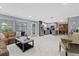 Open concept living space features a living room and updated kitchen with gray cabinets at 1101 N Betty Ln, Clearwater, FL 33755