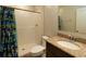 Well-maintained bathroom featuring a granite countertop vanity and tiled walk-in shower at 11134 Horned Owl Rd, Weeki Wachee, FL 34614