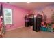 This vibrant bedroom includes a loft bed with a desk area, a whimsical castle mural, and a bright window at 11134 Horned Owl Rd, Weeki Wachee, FL 34614
