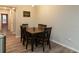 Cozy dining area features wood-look floors, a dark wood table, and comfortable seating at 11134 Horned Owl Rd, Weeki Wachee, FL 34614