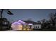 Charming single-Gathering home featuring decorative festive lights, garage and stone detailing at 11134 Horned Owl Rd, Weeki Wachee, FL 34614