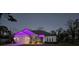 Charming single-Gathering home featuring decorative festive lights, garage and stone detailing at 11134 Horned Owl Rd, Weeki Wachee, FL 34614