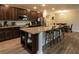 Open kitchen with a large island, granite countertops, and stainless steel appliances at 11134 Horned Owl Rd, Weeki Wachee, FL 34614