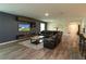 Comfortable living area with stylish decor, a Gathering decal, and wood floors at 11134 Horned Owl Rd, Weeki Wachee, FL 34614