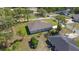 Aerial view of the rear of the home, showcasing the backyard and surrounding neighborhood at 11134 Horned Owl Rd, Weeki Wachee, FL 34614