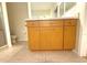 The bathroom has a wood vanity and tiled flooring at 11204 Clear Oak Cir, New Port Richey, FL 34654