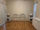 Bedroom features wood floors, neutral walls, and twin wicker headboards at 11204 Clear Oak Cir, New Port Richey, FL 34654