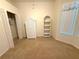 Bedroom showcasing a bay window, a wardrobe cabinet, and neutral walls at 11204 Clear Oak Cir, New Port Richey, FL 34654