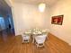 Charming dining room featuring a glass-top table, wicker chairs, and elegant decor for memorable gatherings at 11204 Clear Oak Cir, New Port Richey, FL 34654