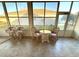 Enclosed lanai offers cozy seating and a view of the home's exterior at 11204 Clear Oak Cir, New Port Richey, FL 34654
