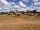 Backyard of the property showing a large open field and other homes in the distance at 13026 Lawrence St, Spring Hill, FL 34609