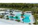 Stunning aerial view of the community pool, lounging areas, and lush landscaping at 17026 Shell Bay Dr, Land O Lakes, FL 34638