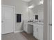 A full bathroom with double sink vanity, and a grey color scheme at 17026 Shell Bay Dr, Land O Lakes, FL 34638