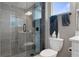 Modern bathroom with sleek glass shower and gray tile at 17026 Shell Bay Dr, Land O Lakes, FL 34638