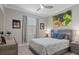 Bedroom featuring custom paint, a large window for lots of natural light, and luxury furnishings at 17026 Shell Bay Dr, Land O Lakes, FL 34638