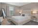This primary bedroom offers neutral walls, a window for natural light, and modern furniture at 17026 Shell Bay Dr, Land O Lakes, FL 34638