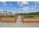 Rows of raised garden beds offer residents the opportunity to grow their own vegetables and herbs at 17026 Shell Bay Dr, Land O Lakes, FL 34638