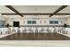 Large event space with round tables, white linens, and a dance floor at 17026 Shell Bay Dr, Land O Lakes, FL 34638