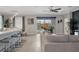 Open-concept living space featuring modern decor, sleek countertops, and a seamless flow to the outdoor patio at 17026 Shell Bay Dr, Land O Lakes, FL 34638