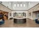 Clubhouse lobby with stone walls, a wood floor, a reception desk, and modern decor at 17026 Shell Bay Dr, Land O Lakes, FL 34638