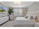 This main bedroom has a sitting area and plenty of natural light with its large window at 17026 Shell Bay Dr, Land O Lakes, FL 34638
