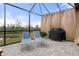 Outdoor patio with seating, grill and views of backyard at 17026 Shell Bay Dr, Land O Lakes, FL 34638